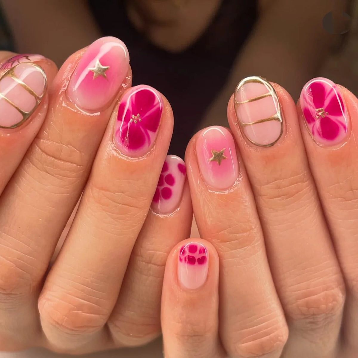 Glossy pink flower press-on nails with gold stripe details