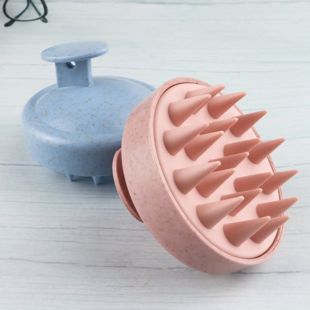 Soft scalp massage brush used during shampooing