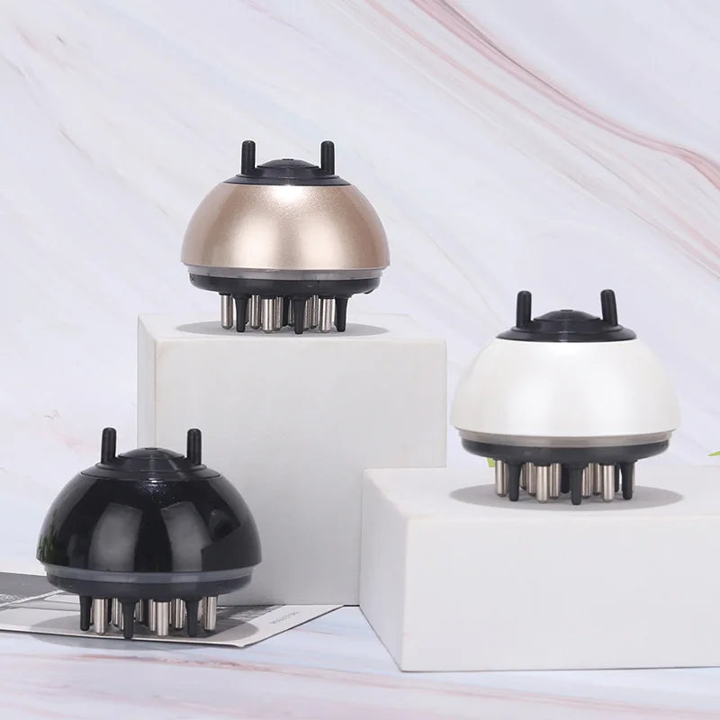 Three handheld massagers in black, gold, and white on a light background